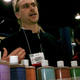 David Bronner, President of Dr. Bronner's Magic Soaps, standing with soap bottles
